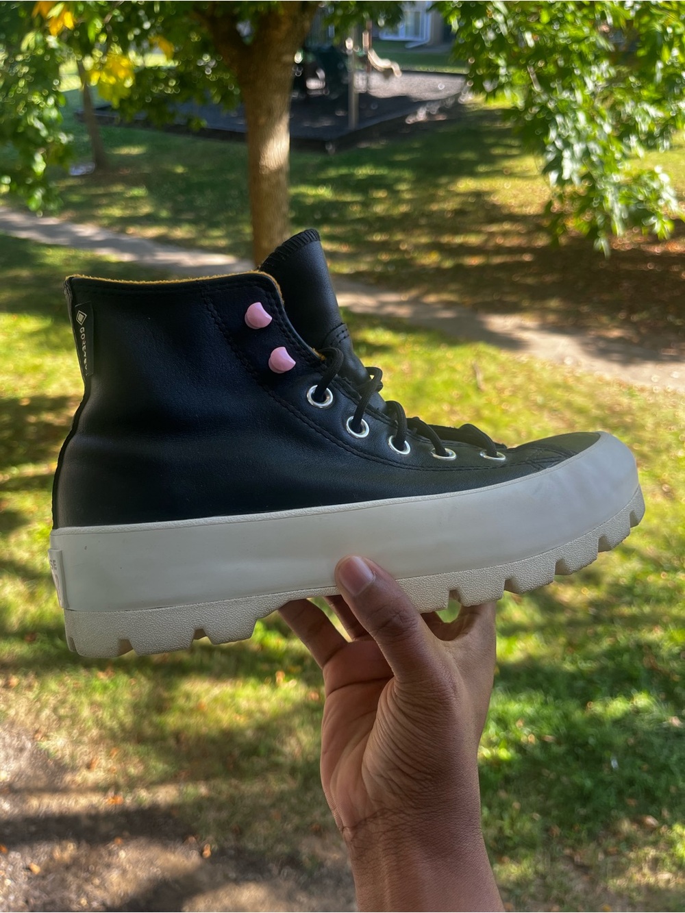 Converse Black High-Top Platform Sneaker with Pink Eyelets